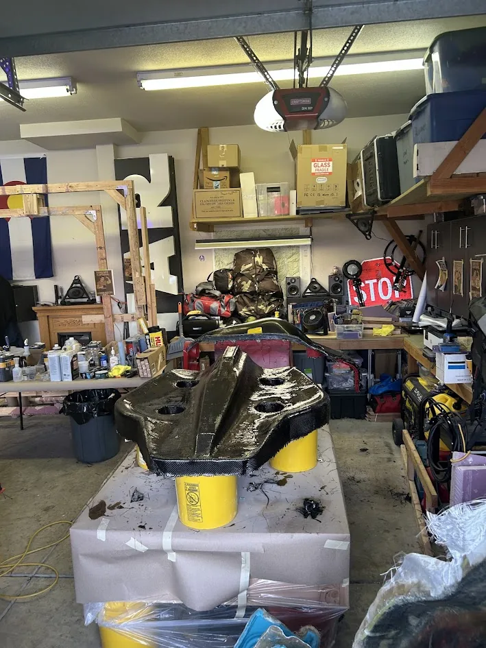 Carbon-fiber composite shell curing on the bench